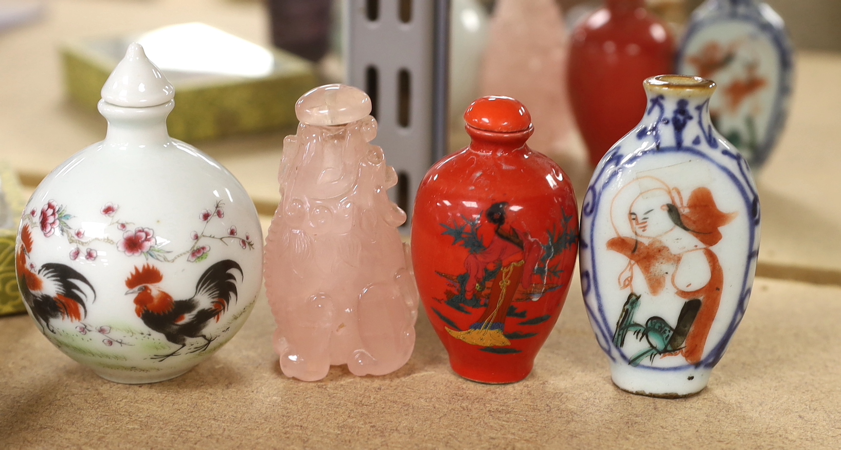 A collection of Oriental and Chinese items including quartz and hand painted snuff bottles, the largest 14cm in length